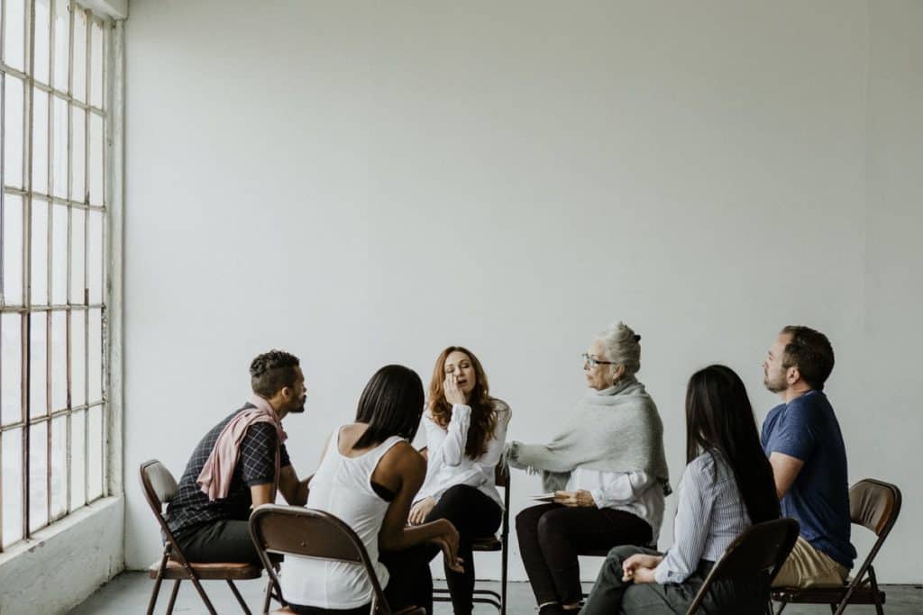 Diverse people in a supporting group session